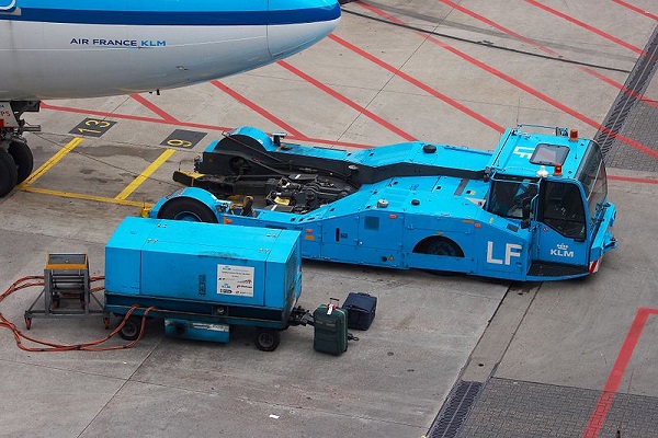  Push-back tractor and ground power unit at Amsterdam - Schiphol (AMS / EHAM) Airport. 